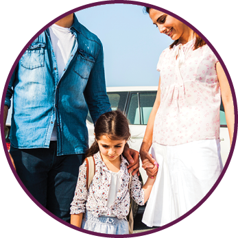 Young family in Dubai - UAE  taking their little girl to school by car in the morning in Jumeirah district  They are happy in a sunny day 